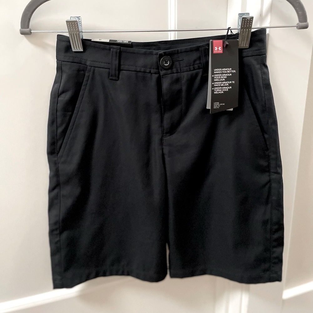 Navy blue Under Armour shorts for boys. These are size 12. They run small.